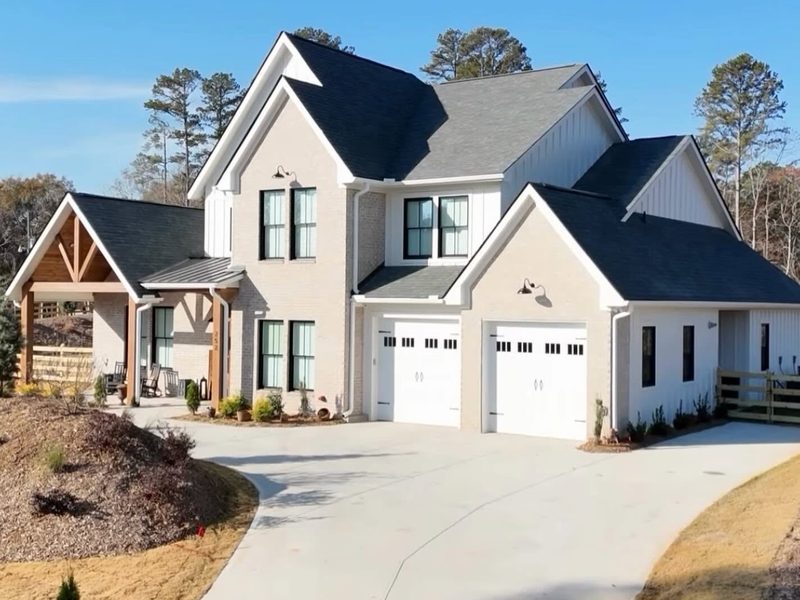 White gutters and downspouts on a two-story home